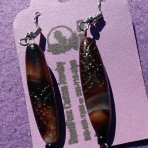 Approx. 2 1/8 inches, Long bone and dark brown beads with a spot of cream and brown with black beads with silver wires. 23.00