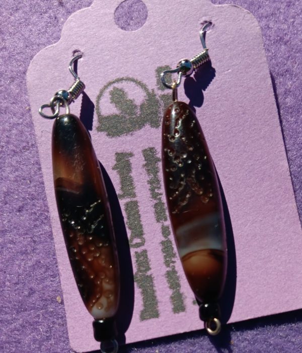 Approx. 2 1/8 inches, Long bone and dark brown beads with a spot of cream and brown with black beads with silver wires. 23.00